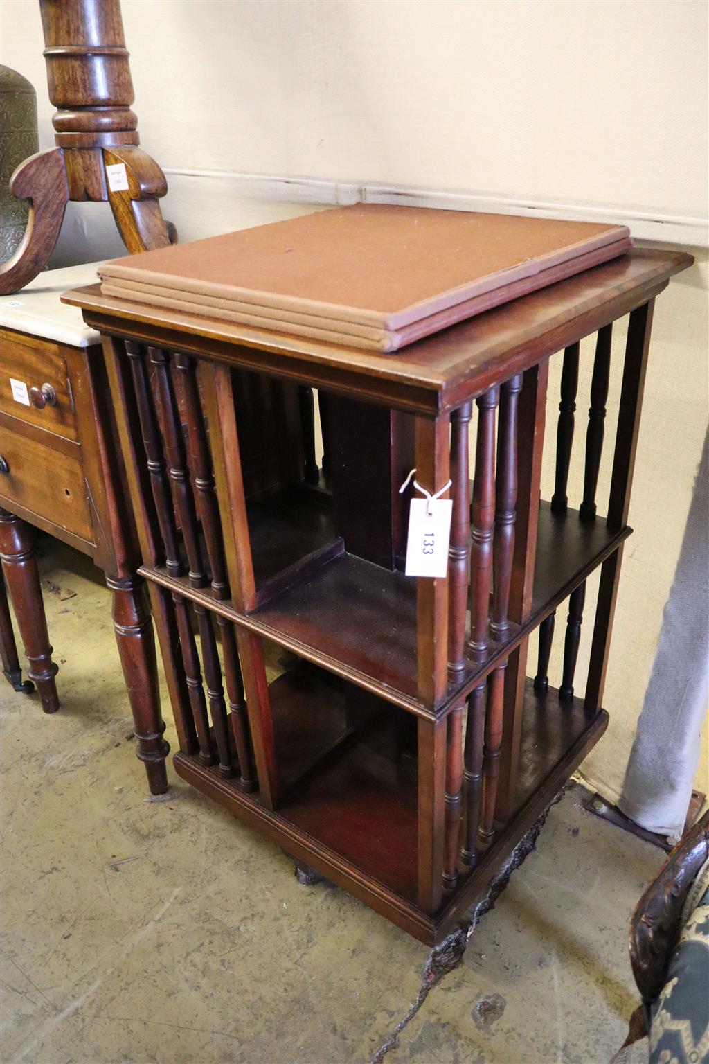 A late Victorian mahogany revolving bookcase, width 52cm, depth 52cm, height 84cm